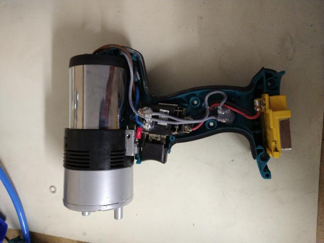 image of open cordless drill with wires